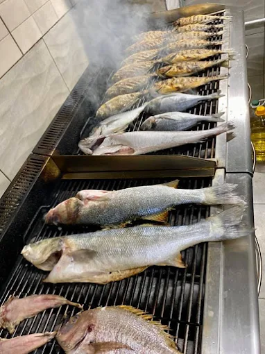 cooked fish  - o psaras tis oikogeneias